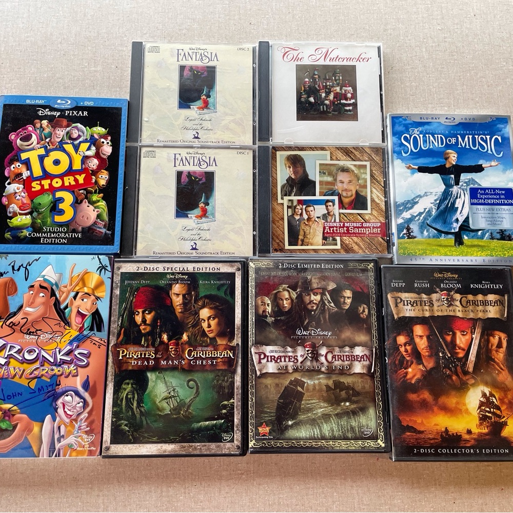 Disney DVDs and music CDs Pirates Fantasia Sound of Music Kronk Toy Story